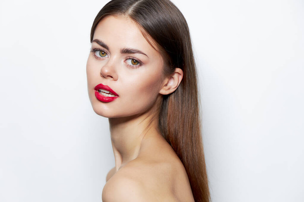 Brunette clear skin Attractive look red lips bared shoulders  - Foto, afbeelding