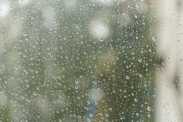 Drops of rain on a window. Abstract background. - 写真・画像