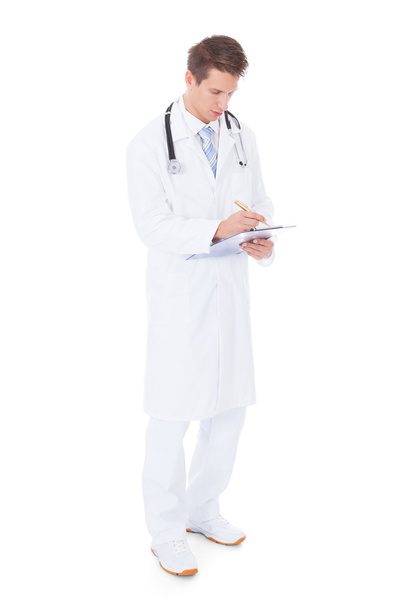Young Male Doctor Holding Clipboard - Foto, Imagem