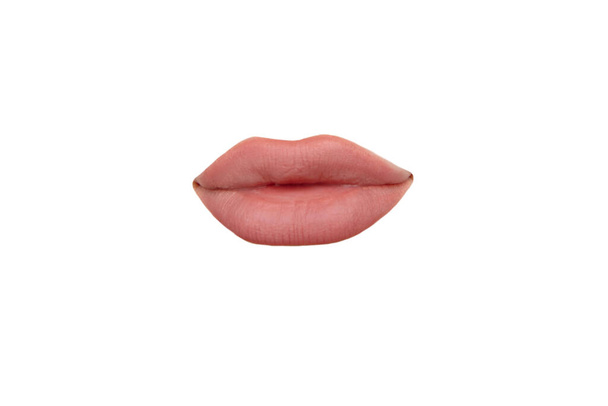 Close up view of female mouth wearing nude lipstick isolated over white studio background - Foto, Imagen