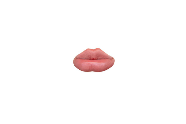 Close up view of female mouth wearing nude lipstick isolated over white studio background - Zdjęcie, obraz