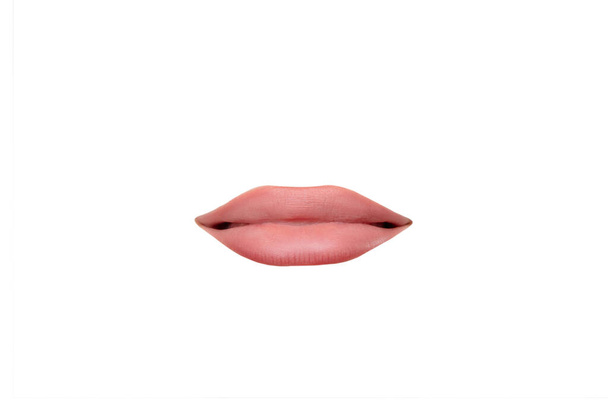 Close up view of female mouth wearing nude lipstick isolated over white studio background - Foto, Imagem
