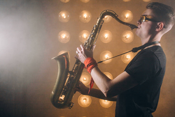awesome stylish guy blowing in the sax - Foto, Bild