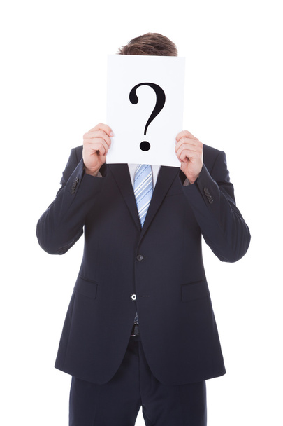 Businessman Holding Question Mark Sign In Front Of Face - Foto, immagini