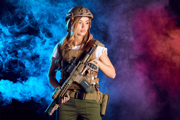 Woman in army pros and cons.Beautiful woman in military ammunition and weapon. - Fotoğraf, Görsel