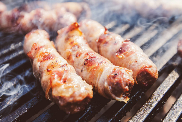 Delicious rolled meat with bacon on BBQ party . - Foto, Imagen