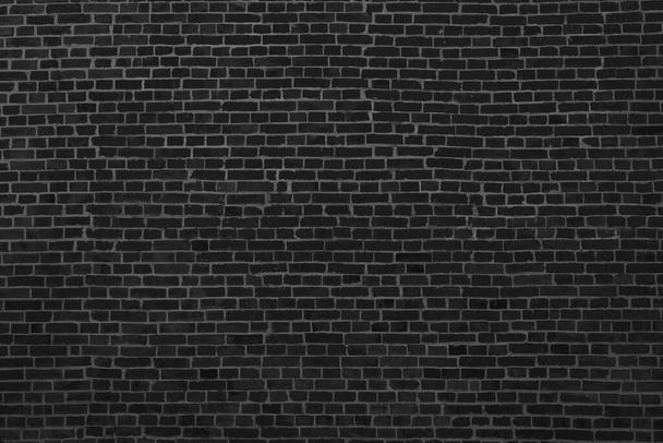 De achtergrond van de oude zwarte bakstenen muur voor design interieur en diverse scènes of als achtergrond voor video-interviews. - Foto, afbeelding