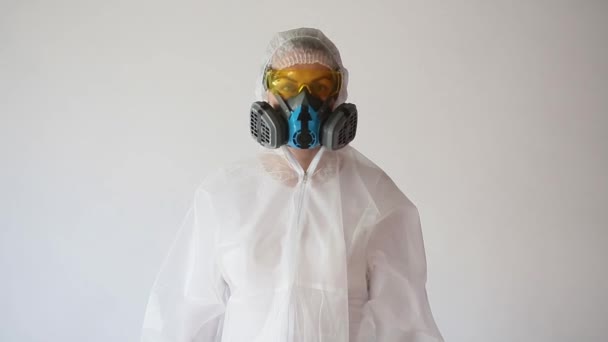 A doctor or researcher in a protective suit nods and shows thumbs up - Footage, Video