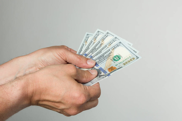 men's hand with a bunch of dollar bills - Photo, Image