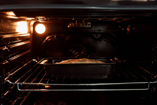 Crumby bread dough was bakaking in the oven on over rack. - Fotografie, Obrázek