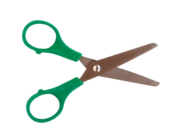 Zelené nůžky a malé pro dítě na bílém pozadí. - Fotografie, Obrázek