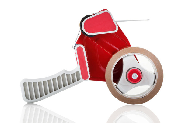 Side view of a red parcel tape dispenser on white background - Photo, Image