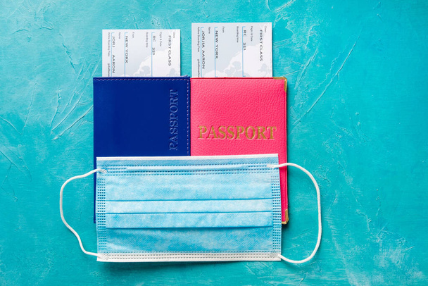 family trip hygiene protection pink blue passports - 写真・画像