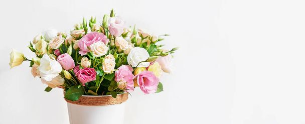Flowers for women's day. Mother's day greeting card. Bouquet of flowers eustoma and roses in vase. Happy Birthday! Valentine's day gift. 14 February. I love you concept. Flower delivery. - Fotó, kép