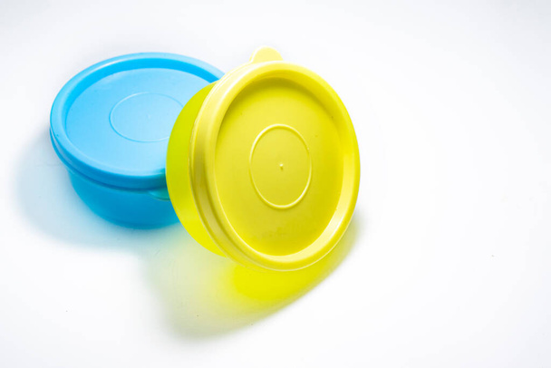 One yellow and one blue container on white background. - Foto, immagini