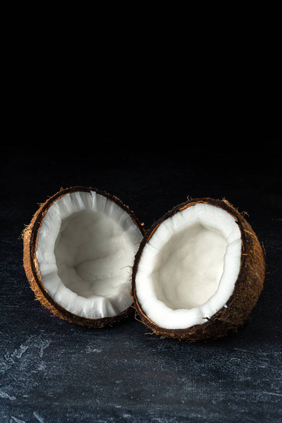 Coconut on a black background - Photo, Image