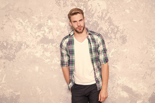 male fashion spring collection. charismatic student checkered shirt. unshaven man care his look. barbershop concept. mens sensuality. sexy guy casual style. macho man grunge background - Photo, Image