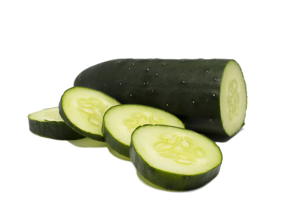 Cucumber and slices on a white background. Completely clean. Ready for further processing. - Photo, Image