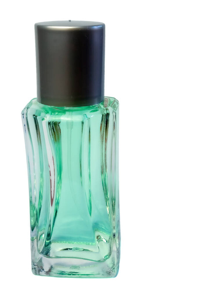 зелено-ароматизована рідина в скляній флаконі
 - Фото, зображення