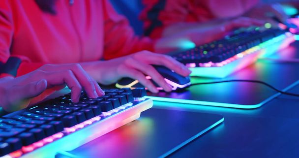 close up of cyber sport gamers team play game while clicking the mouse and keyboard - Фото, изображение