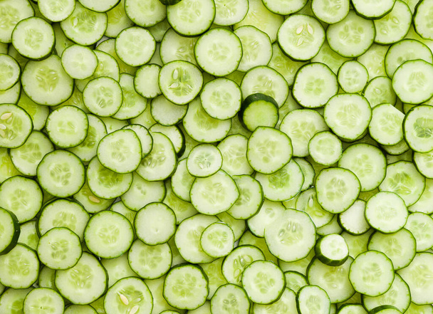 top view of  lots of cucumber slices. Food background - Photo, Image