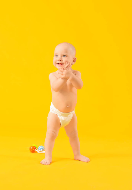 Portrait of cute little baby on color background - Photo, Image