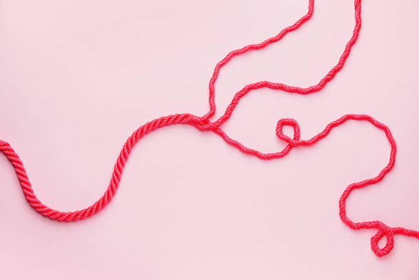 Long rope on color background - Photo, Image