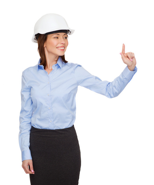 Young smiling businesswoman in white helmet - Fotoğraf, Görsel