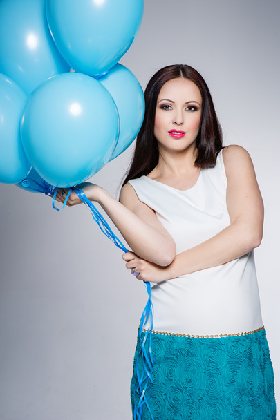 Pregnant woman with blue balloons - Photo, Image