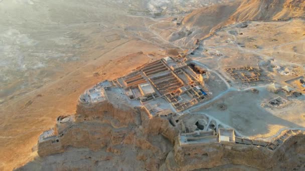 Aerial view of the ruins of Massada is a fortress built by Herod the Great on a cliff-top off the coast of the Dead Sea. Destroyed by the Romans in the 1st century AD e. Included in the UNESCO World H - Footage, Video