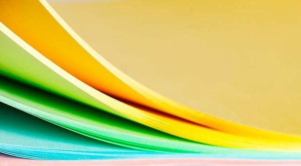 Sheets of multi-colored paper on a white background - Foto, Imagem