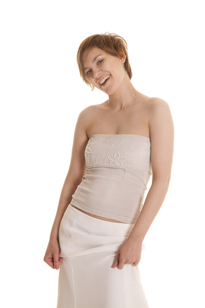 nő, fehér felső, és szoknya mosolyogva - Fotó, kép