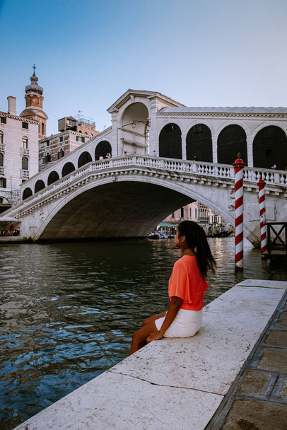 woman on a city trip to Venice Italy, colorful streets with canals Venice - Photo, Image