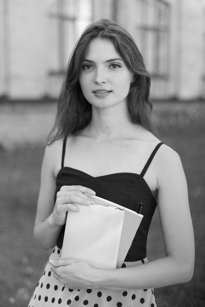 Young girl student in dress. Black and white photo. BW - Foto, Bild