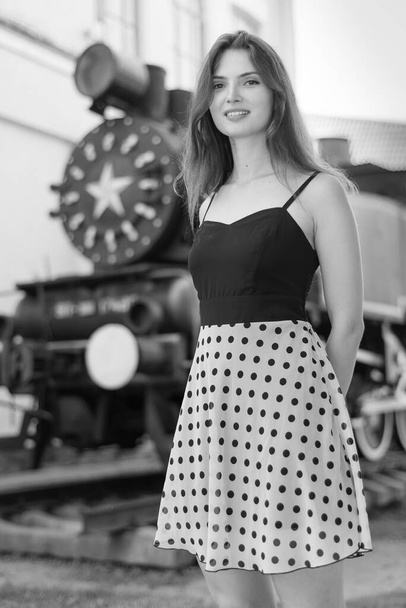 Girl in a white-black dress with polka dots. Black and white photo. BW - Foto, Imagem