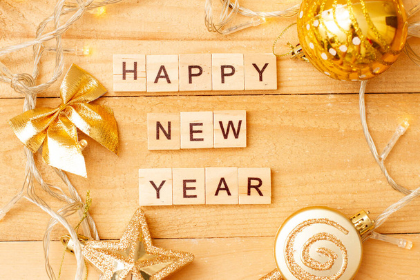 Word HAPPY NEW YEAR made from wooden cubes with decoration for Chistmas. Banner, backdrop. - Фото, изображение