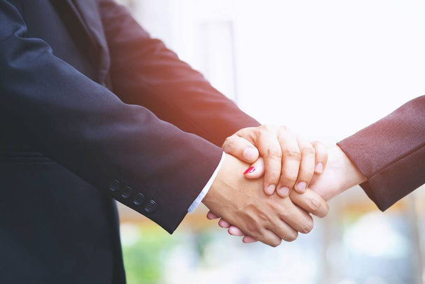 businessman shaking hands with businesswoman after UI UX desiner meeting. - Photo, Image