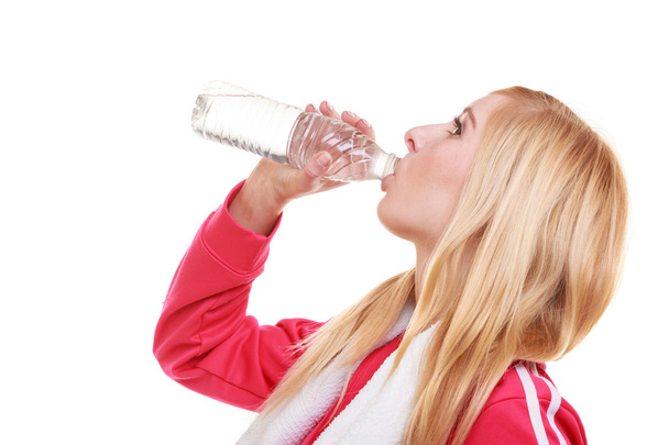 Fitness woman sport girl with towel drinking water from bottle isolated - Fotografie, Obrázek
