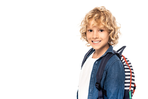 curly blonde schoolkid with backpack looking at camera isolated on white  - Φωτογραφία, εικόνα