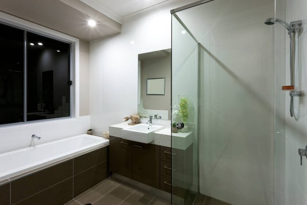 A luxury modern bathroom interior design view - Фото, изображение