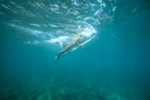 Female surfer underwater - Фото, изображение