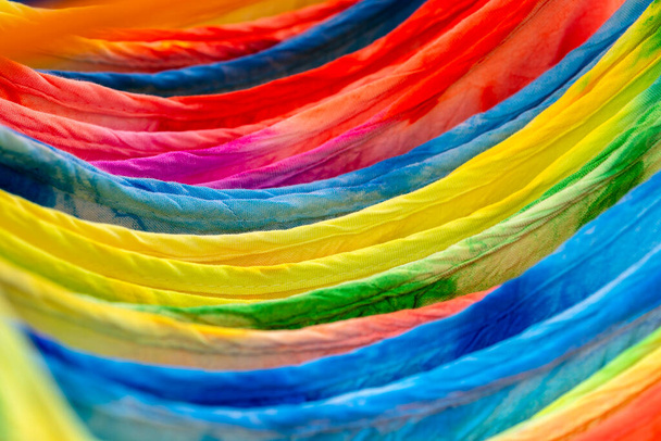 Colorful summer clothes on hangers for sale in local street market in Thailand, close up - Фото, зображення