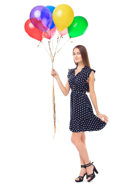 Beautiful young woman holding balloons - Photo, image