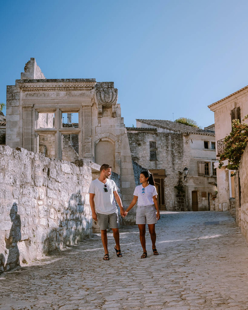 couple visit the town of Les Baux de Provence France, old historical village build on a hill in the Provence, Les Baux de Provence village on the rock formation and its castle. France, Europe - Photo, Image