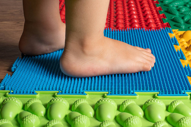 Prevention of flat feet in children, foot massage. - Photo, Image