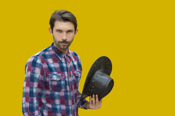 young cowboy with mustache and beard on yellow background - Fotografie, Obrázek