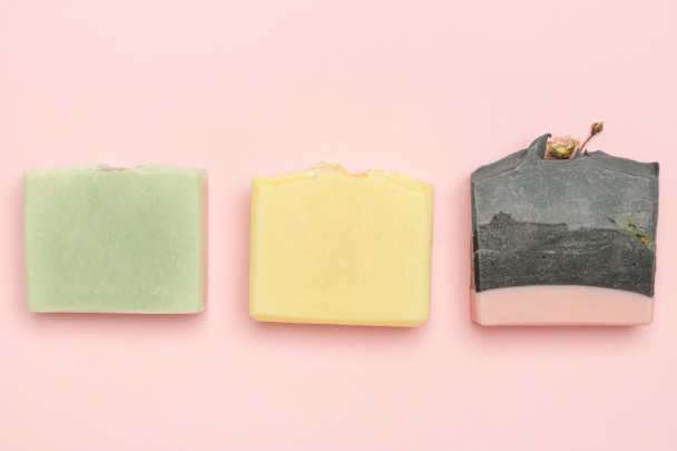 Handmade soap bars on pink background. Homemade toxic-free natural organic cosmetic - Foto, Imagem