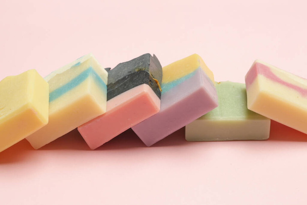 Handmade soap bars on pink background. Homemade toxic-free natural organic cosmetic - Foto, Imagen