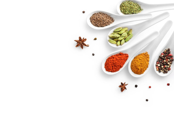 Top view of various spices in spoons isolated on white background. Copy space. - Photo, Image