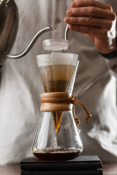 Brewing Pour Over Style of Coffee Making Dripping with Bubbles. Alternative coffee-making methods. Beautiful close up view or preparing morning coffee. Coffee industry. Coffee shop concept - Φωτογραφία, εικόνα